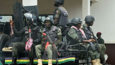 Police men sit on a truck as they patrol ahead of next November 6 governorship election in Akwa, Anambra State in southeast Nigeria, on November 3, 2021. - Nigeria's southeast Anambra state holds elections for local governor's office on NOvember 6, 2021 in a ballot being widely watched as barometer for the country's 2023 presidential vote. More than 30,300 police have been dispatched to secure the state where separatist tensions have been on the rise and the vote will test electoral authorities abilities to organise a ballot in difficult circumstances. (Photo by PIUS UTOMI EKPEI / AFP) (Photo by PIUS UTOMI EKPEI/AFP via Getty Images)