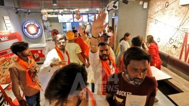 Activists of Bajrang Dal, a Hindu hardline group, shout slogans inside a Pizza Hut food outlet during a protest over their Pakistani partners' tweet in support of Kashmir, in Ahmedabad, India, February 12, 2022. REUTERS/Amit Dave